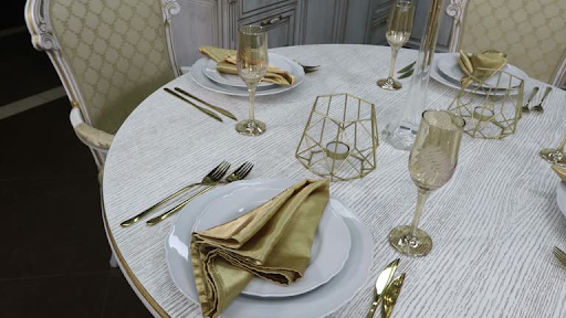 Stylish disposable tableware and table accessories organized for an outdoor occasion